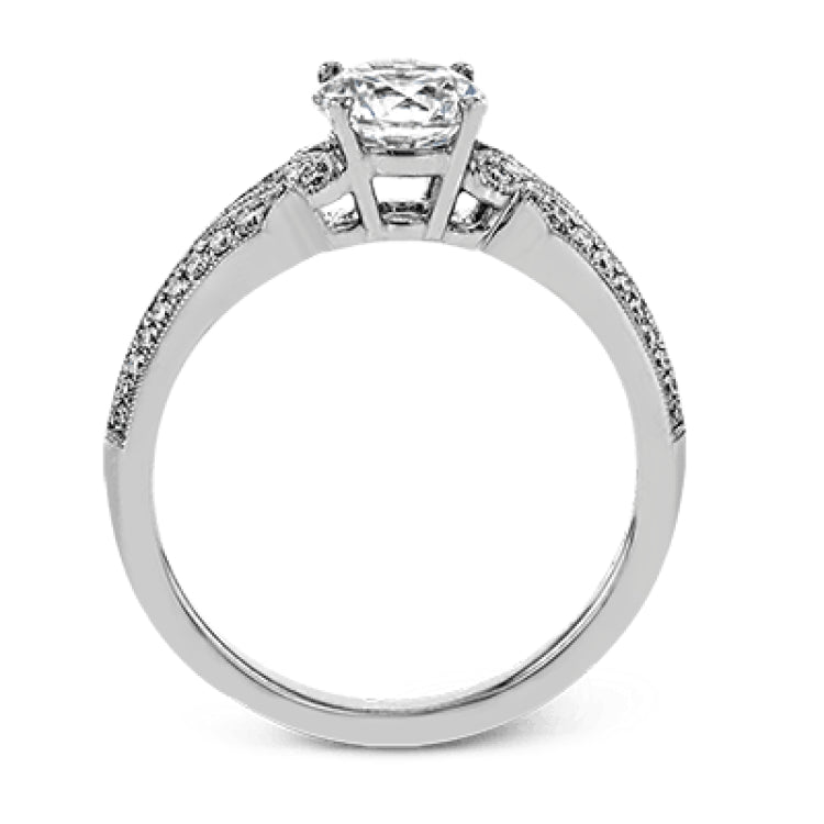 This remarkable white gold ring features .18 ctw of round white diamonds and delicate milgrain edging for a sleek, romantic look.