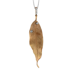 This amazing 18k rose gold pendant captures the beauty of a single leaf in extraordinary detail. A couple of white diamonds totaling .08 ctw add a subtle sparkle.