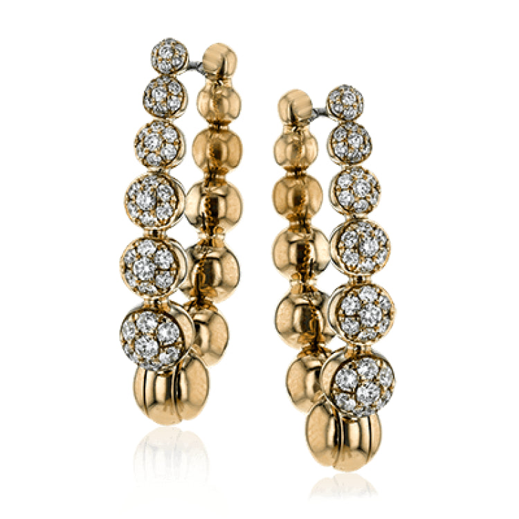 .50 ctw of white diamonds sparkle against beautiful rose gold droplets in these elegant, unique earrings