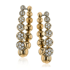 .50 ctw of white diamonds sparkle against beautiful rose gold droplets in these elegant, unique earrings