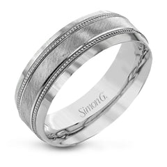 A textured white gold exterior conceals a rose gold interior accent in this elegant, modern wedding band