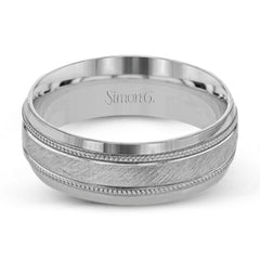 A textured white gold exterior conceals a rose gold interior accent in this elegant, modern wedding band