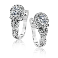 Magnificently glamorous, these white gold earrings feature delicate milgrain edging along with .21 ctw of round white diamond accents.