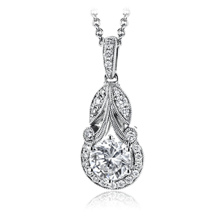 This classic, elegant white gold pendant features .16 ctw of round white diamond accents in a vintage-inspired setting.