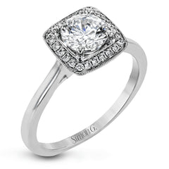 Tasteful yet glamorous, this white gold ring features an eye-catching square halo that glitters with .11 ctw of round white diamonds.