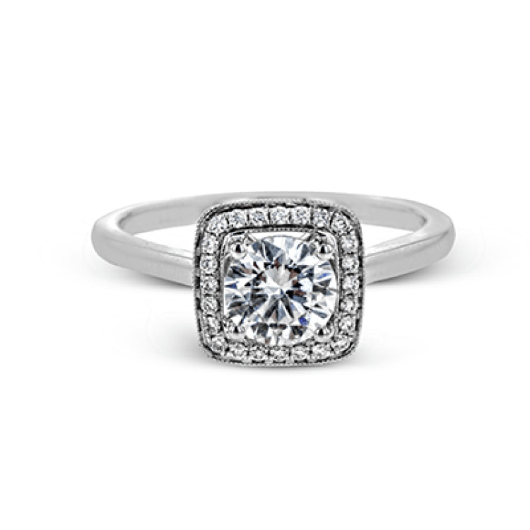 Tasteful yet glamorous, this white gold ring features an eye-catching square halo that glitters with .11 ctw of round white diamonds.