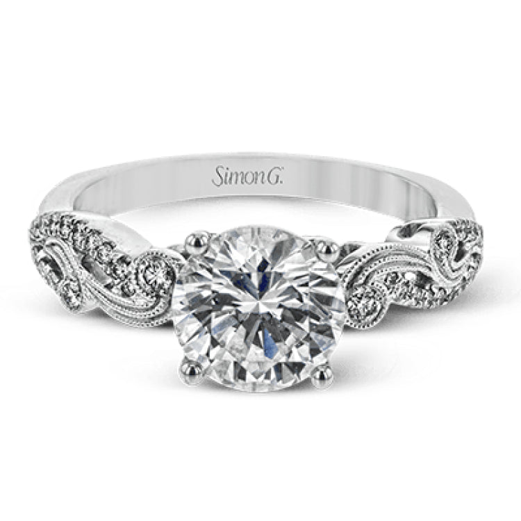 The swirling, organic design of this white gold engagement ring features .19 ctw of round white diamonds for added charm.