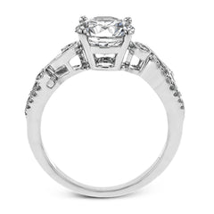 The swirling, organic design of this white gold engagement ring features .19 ctw of round white diamonds for added charm.