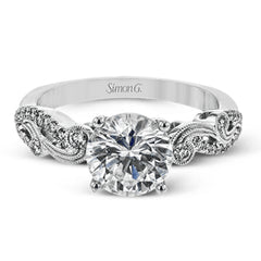 The swirling, organic design of this white gold engagement ring features .19 ctw of round white diamonds for added charm.