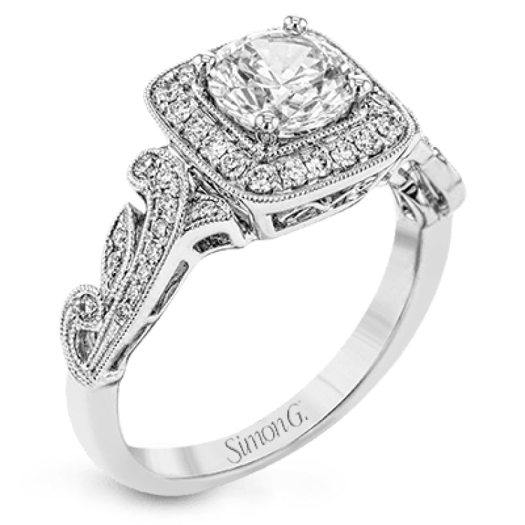 This dazzling, vintage-inspired white gold ring balances organic and geometric shapes with the help of .28 ctw of round white diamond accents.