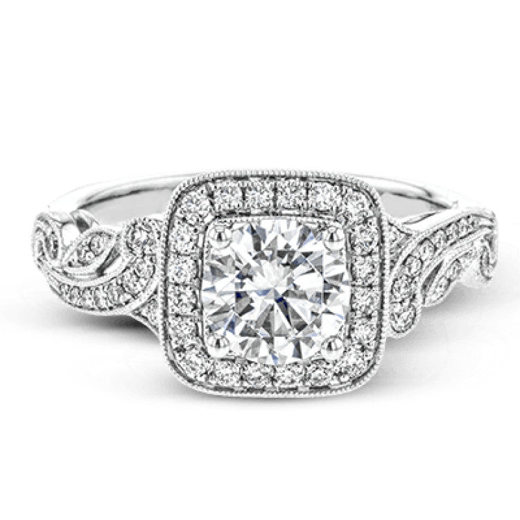 This dazzling, vintage-inspired white gold ring balances organic and geometric shapes with the help of .28 ctw of round white diamond accents.