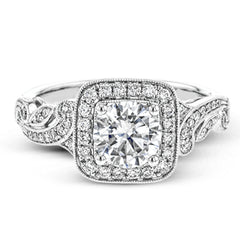 This dazzling, vintage-inspired white gold ring balances organic and geometric shapes with the help of .28 ctw of round white diamond accents.