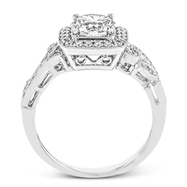 This dazzling, vintage-inspired white gold ring balances organic and geometric shapes with the help of .28 ctw of round white diamond accents.