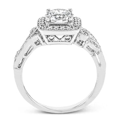 This dazzling, vintage-inspired white gold ring balances organic and geometric shapes with the help of .28 ctw of round white diamond accents.