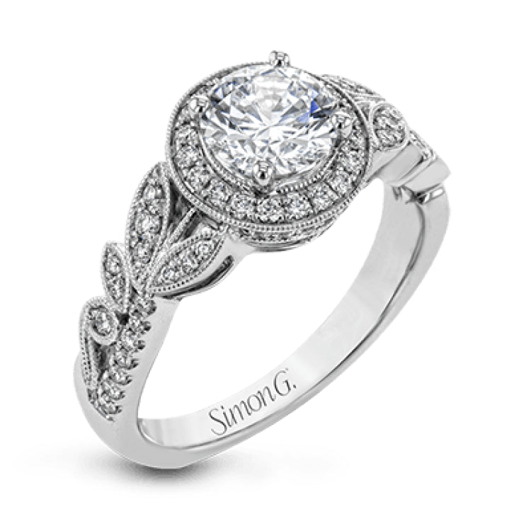 The stunning nature-inspired design of this white gold engagement ring features lovely milgrain edging and a total of .34 ctw of round white diamond accents.