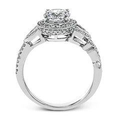 The stunning nature-inspired design of this white gold engagement ring features lovely milgrain edging and a total of .34 ctw of round white diamond accents.