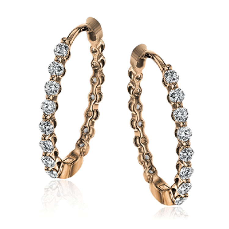 These classic rose gold hoops glimmer with .33 ctw of white diamonds