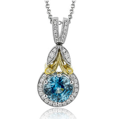 This vintage-inspired white gold pendant features a gorgeous 2.42 ctw blue zircon, complemented by .19 ctw of white diamonds and a yellow gold accent