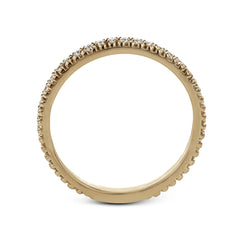 A line of .33 ctw of white diamonds sits alongside a row of granulation in this band that adds the ideal touch of shine. Perfect for stacking with other rings.