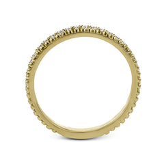A line of .33 ctw of white diamonds sits alongside a row of granulation in this band that adds the ideal touch of shine. Perfect for stacking with other rings.