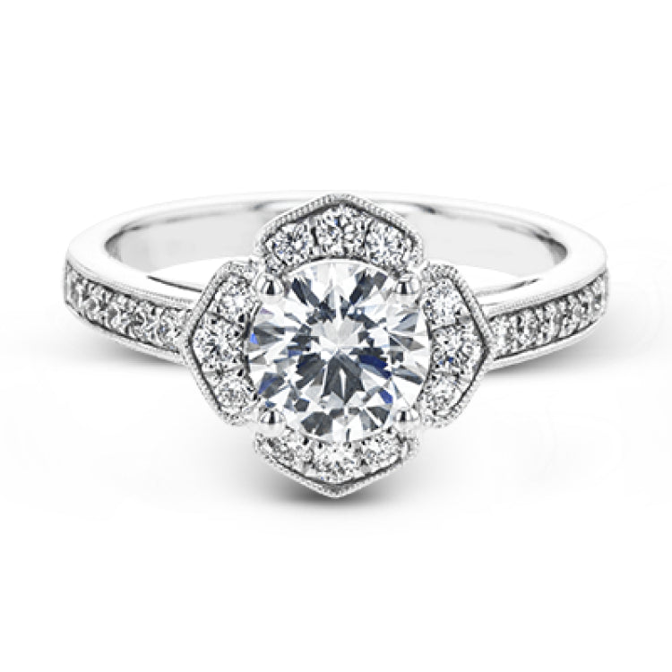 A floral inspired diamond engagement rng 0.35 ctw. has a vintage touch of milgrain beading, and is made to hold a 1.0 ct center