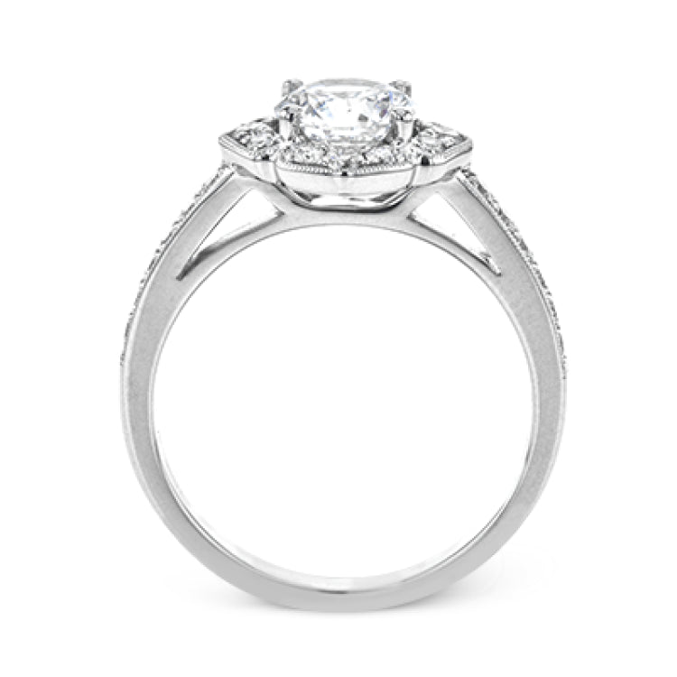 A floral inspired diamond engagement rng 0.35 ctw. has a vintage touch of milgrain beading, and is made to hold a 1.0 ct center