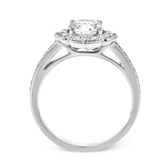 A floral inspired diamond engagement rng 0.35 ctw. has a vintage touch of milgrain beading, and is made to hold a 1.0 ct center