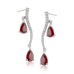 2.07 ctw of elegant ruby teardrops are complemented by .16 ctw of white diamonds in these opulent, glamorous white gold earrings