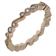 This vintage inspired 18k rose gold ring contains .12 ctw of round white diamonds in a delicate swirling design. Perfect for stacking.