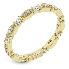 This 18k yellow gold band is perfect for layering with others and contains .31 ctw of white diamonds. Perfect for stacking.