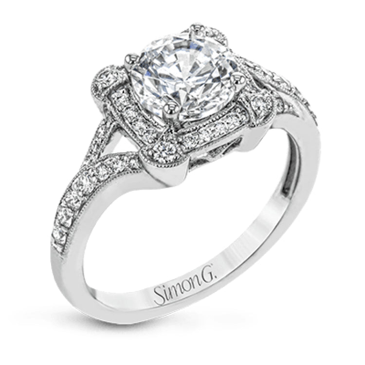 Beautiful and timeless, this white gold ring's intricately detailed design features milgrain edging and .33 ctw of round white diamonds.