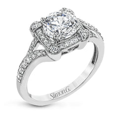 Beautiful and timeless, this white gold ring's intricately detailed design features milgrain edging and .33 ctw of round white diamonds.