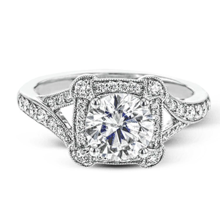 Beautiful and timeless, this white gold ring's intricately detailed design features milgrain edging and .33 ctw of round white diamonds.