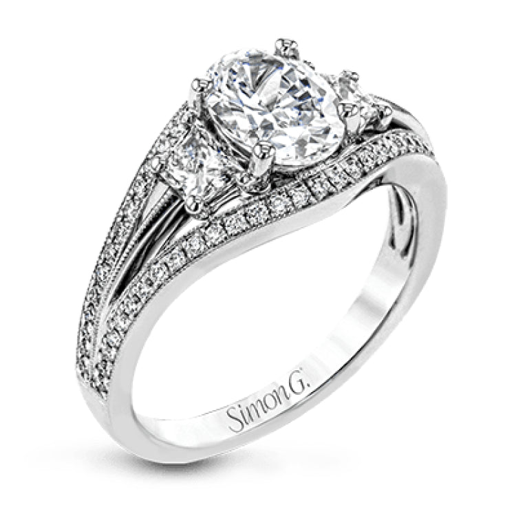 This remarkable white gold ring shows off an oval shaped centerpiece flanked by .47 ctw of trapezoid shaped white diamonds alongside .27 ctw of round white diamonds.