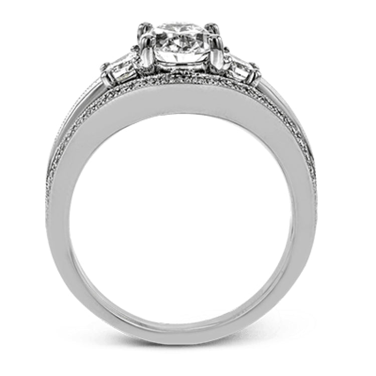 This remarkable white gold ring shows off an oval shaped centerpiece flanked by .47 ctw of trapezoid shaped white diamonds alongside .27 ctw of round white diamonds.