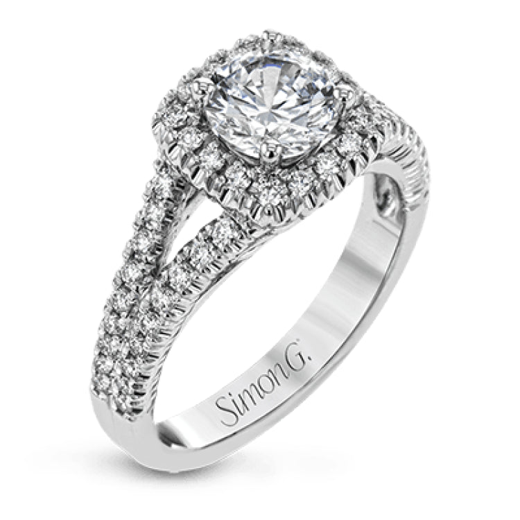 This elegant, contemporary design in white gold sparkles with .45 ctw of round white diamonds in its halo and split shank.