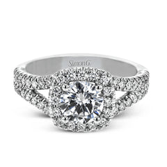 This elegant, contemporary design in white gold sparkles with .45 ctw of round white diamonds in its halo and split shank.