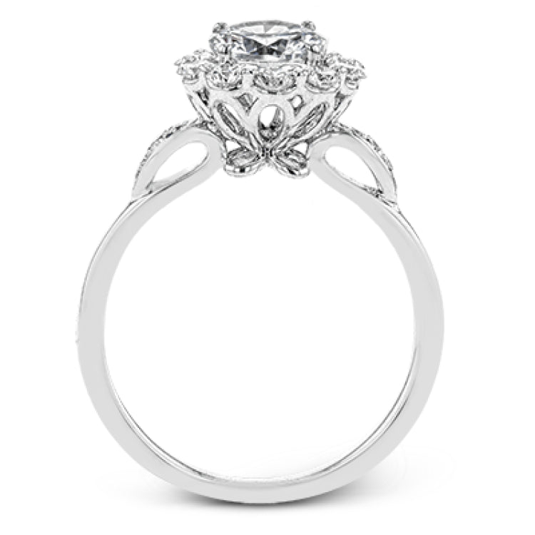 This stunning, contemporary design features .36 ctw of round white diamonds set in its exaggerated halo and delicate side details to evoke a charming floral motif.