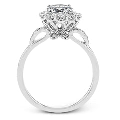 This stunning, contemporary design features .36 ctw of round white diamonds set in its exaggerated halo and delicate side details to evoke a charming floral motif.