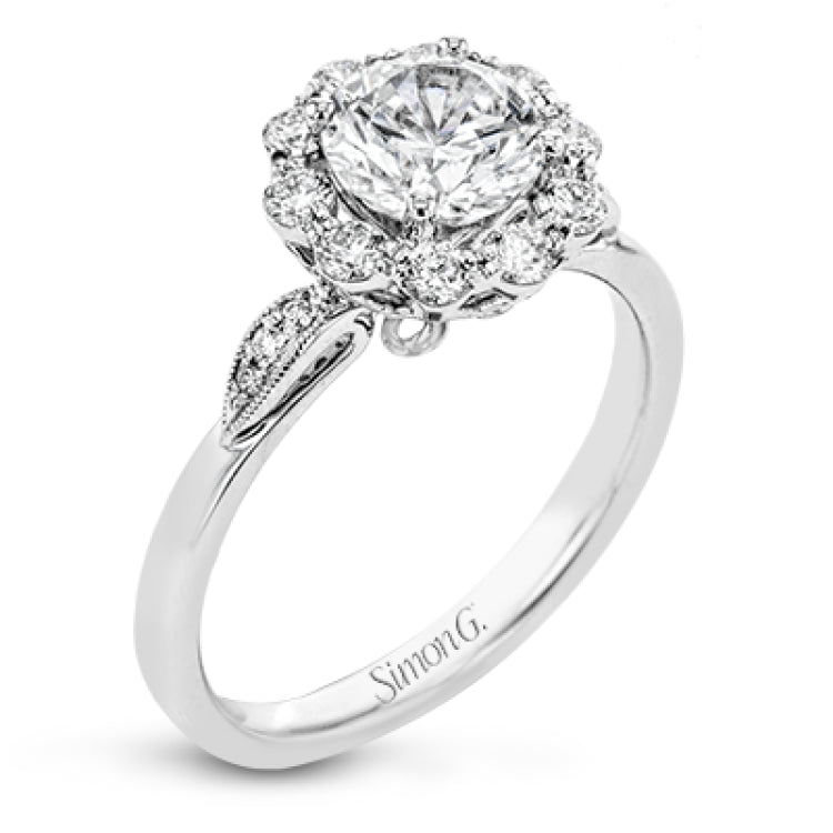 This stunning, contemporary design features .36 ctw of round white diamonds set in its exaggerated halo and delicate side details to evoke a charming floral motif.