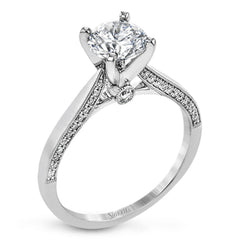 This absolutely stunning white gold engagement ring features a sleek design with .21 ctw of round white diamonds for a touch of glamour.