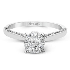 This absolutely stunning white gold engagement ring features a sleek design with .21 ctw of round white diamonds for a touch of glamour.