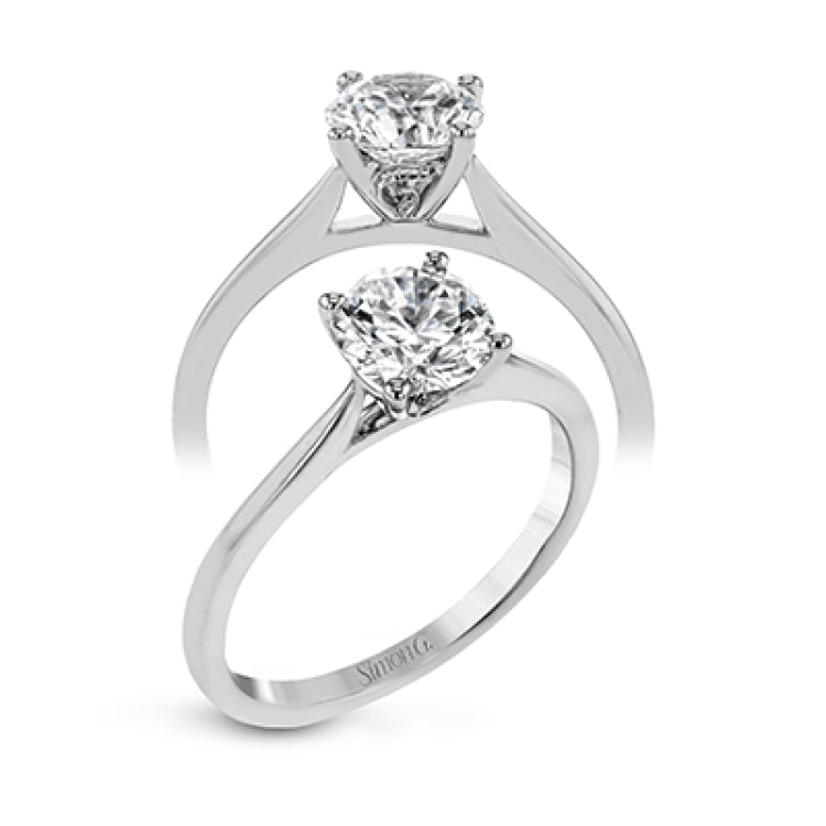 The clean lines of this white gold ring perfectly frame a single round stone as a centerpiece.