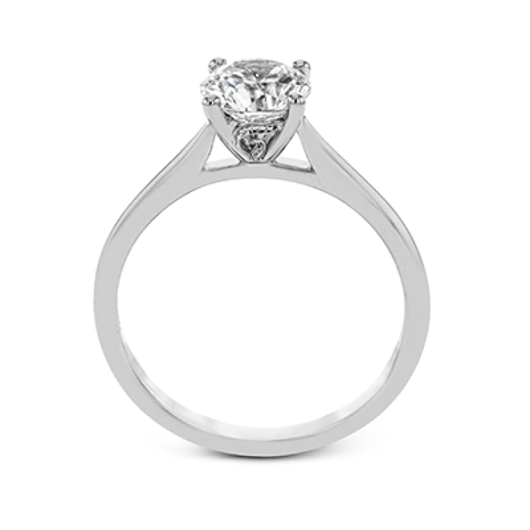 The clean lines of this white gold ring perfectly frame a single round stone as a centerpiece.
