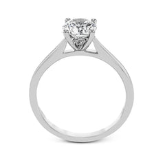 The clean lines of this white gold ring perfectly frame a single round stone as a centerpiece.