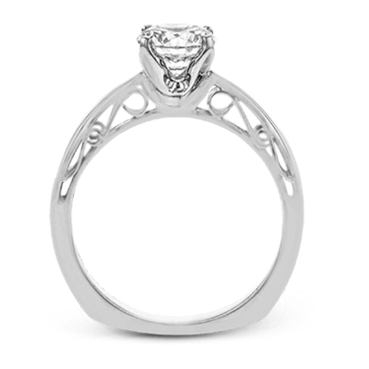 This sleek, elegant white gold ring features delicate filigree detailing to accentuate its single, central stone.