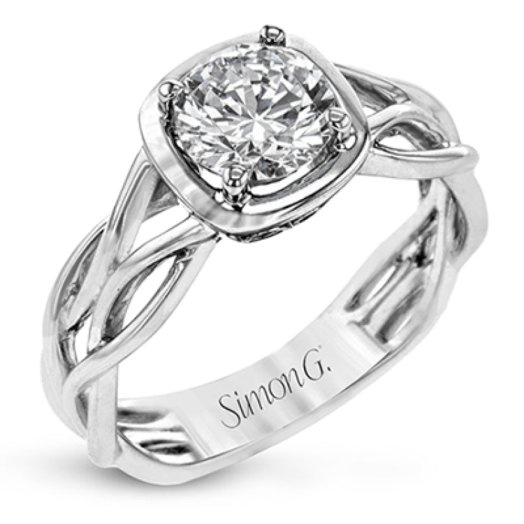 The flowing, organic lines of this contemporary, nature-inspired white gold ring provide a beautifully understated setting for a single, central stone.