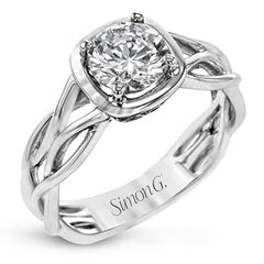 The flowing, organic lines of this contemporary, nature-inspired white gold ring provide a beautifully understated setting for a single, central stone.