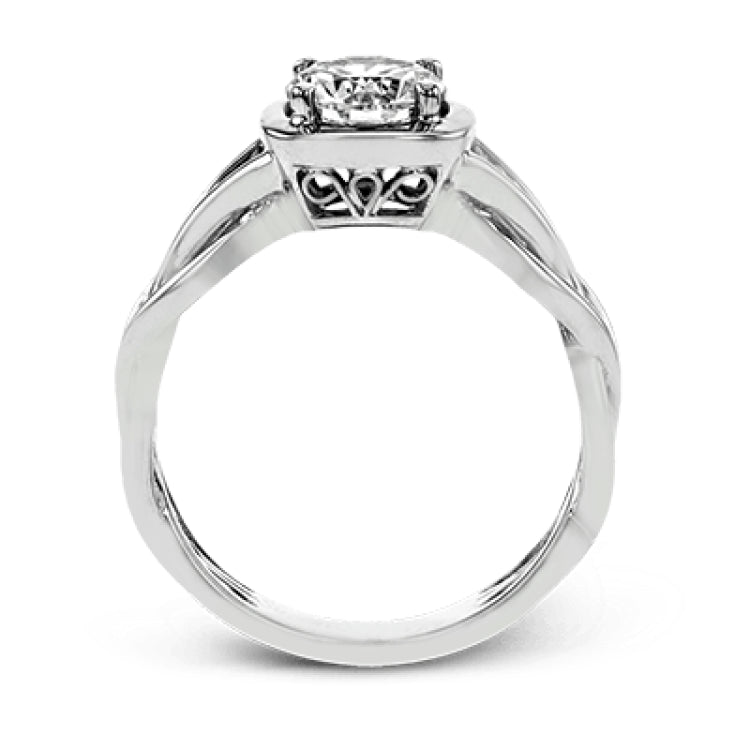 The flowing, organic lines of this contemporary, nature-inspired white gold ring provide a beautifully understated setting for a single, central stone.