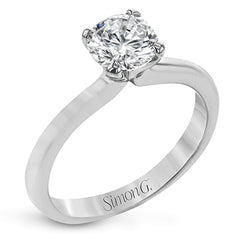 This sleek, unadorned white gold ring provides an elegantly modern setting for a single, central stone.